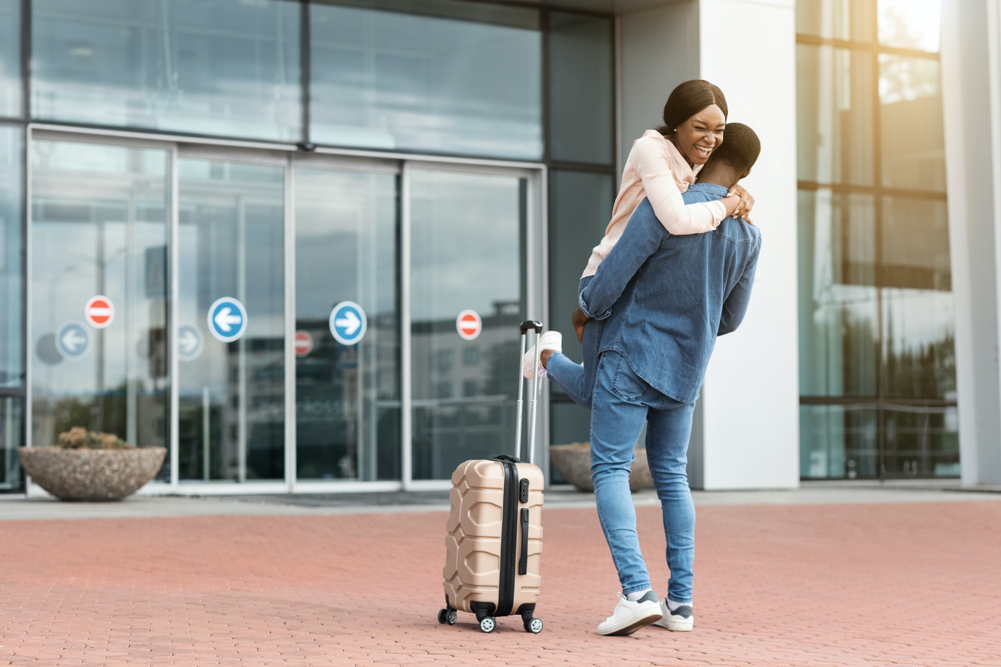 Family Reunion. Happy Black Couple Meeting At Airport After Arrival